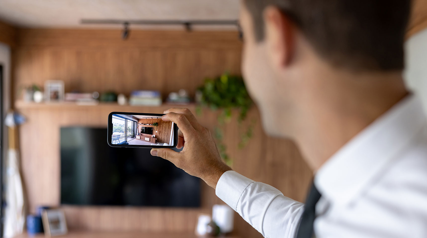 Realtor taking pictures of a house