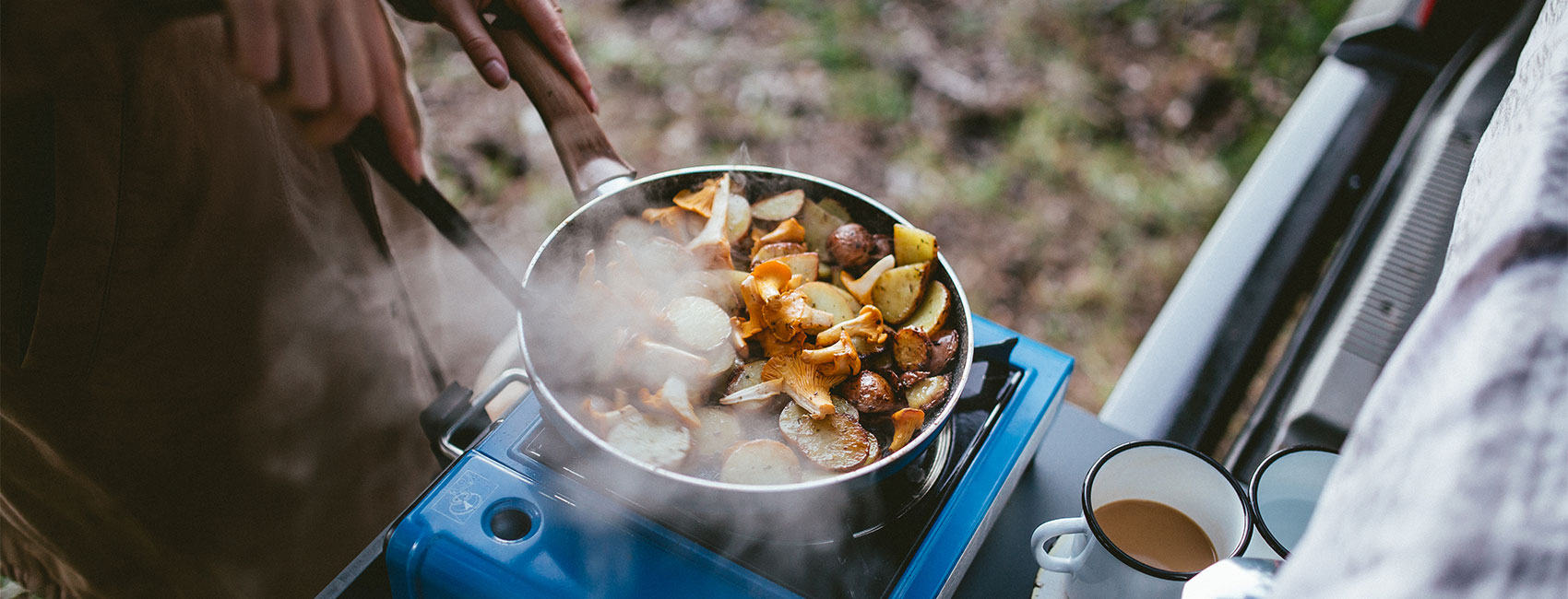 Food is being prepared on the electric stove during camping