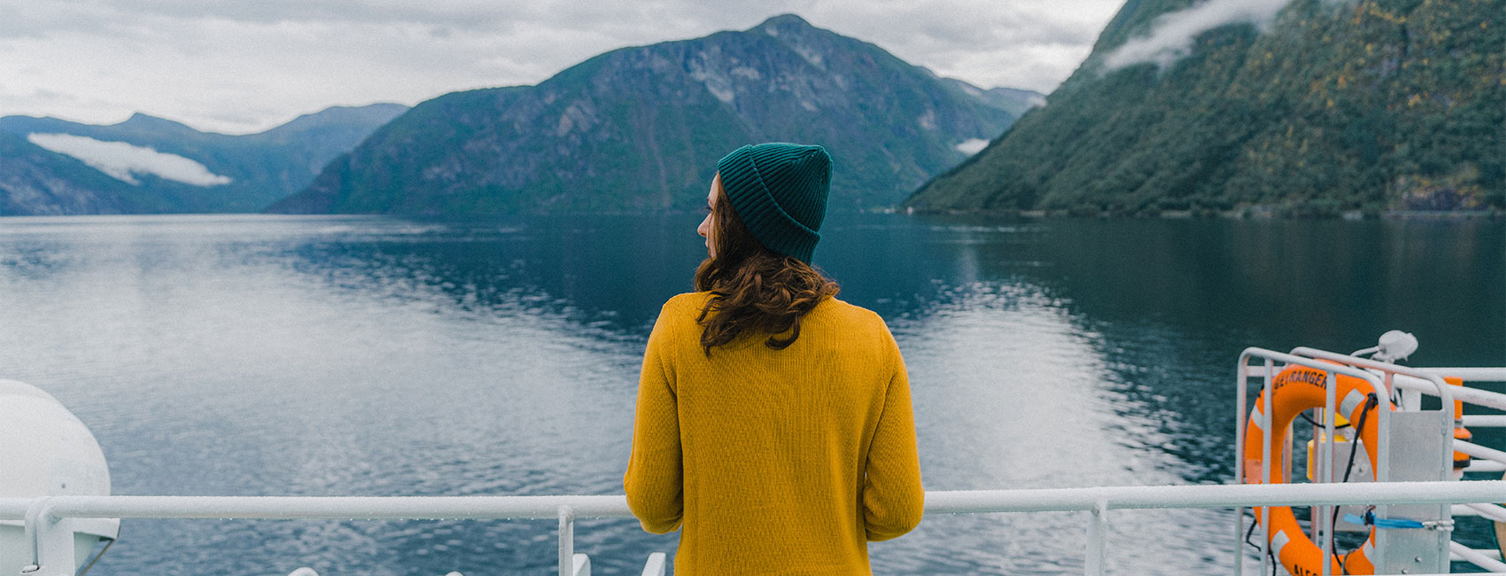 Woman enjoying an island view from a ferry