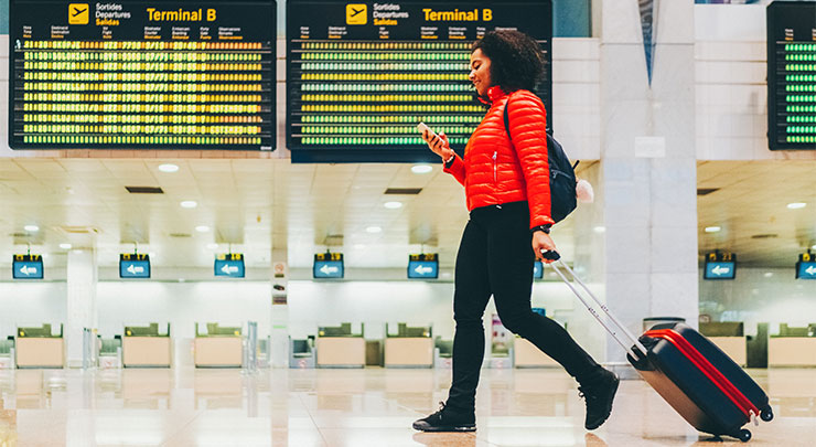 Lady with a handbag changing terminals