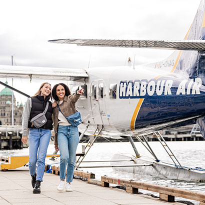 Two friends with a Harbour Air Seaplane