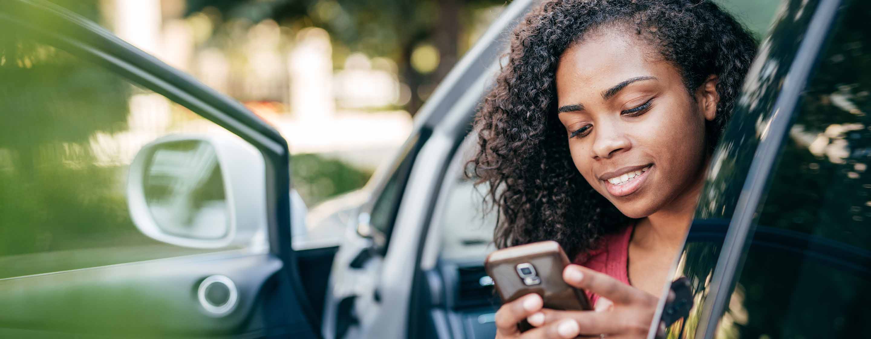 woman looking at her smart phone